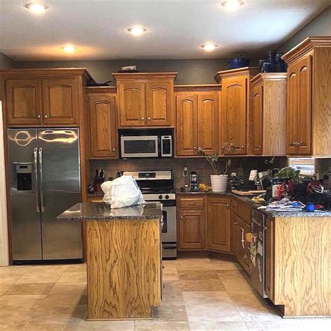 stainless steel vs black stainless with honey oak cabinets|honey oak cabinets green.